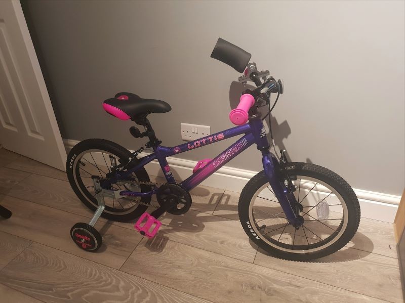 Other image for Dad encourages children to get on their bikes...